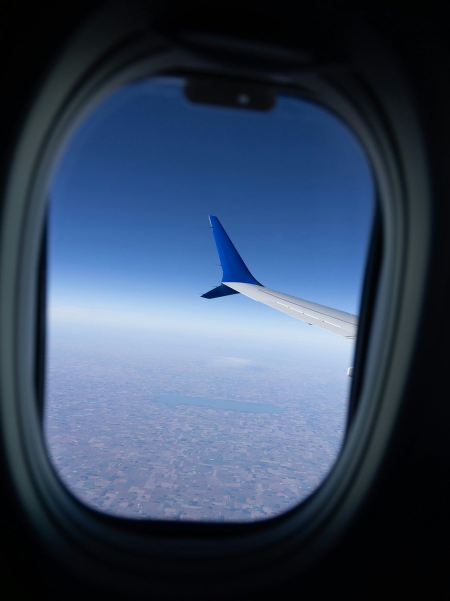 The view of the clouds and the earth from an aeroplane window